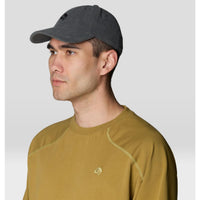 Dark gray corduroy baseball cap worn by male model, side profile view