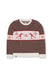 Crew neck knit sweater with brown dotted pattern and cream band featuring red skiers and snowflakes