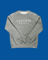 Grey heather crewneck sweatshirt with printed chest graphic, flat lay front view