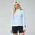 Light blue athletic half-zip pullover with long sleeves on model, front view