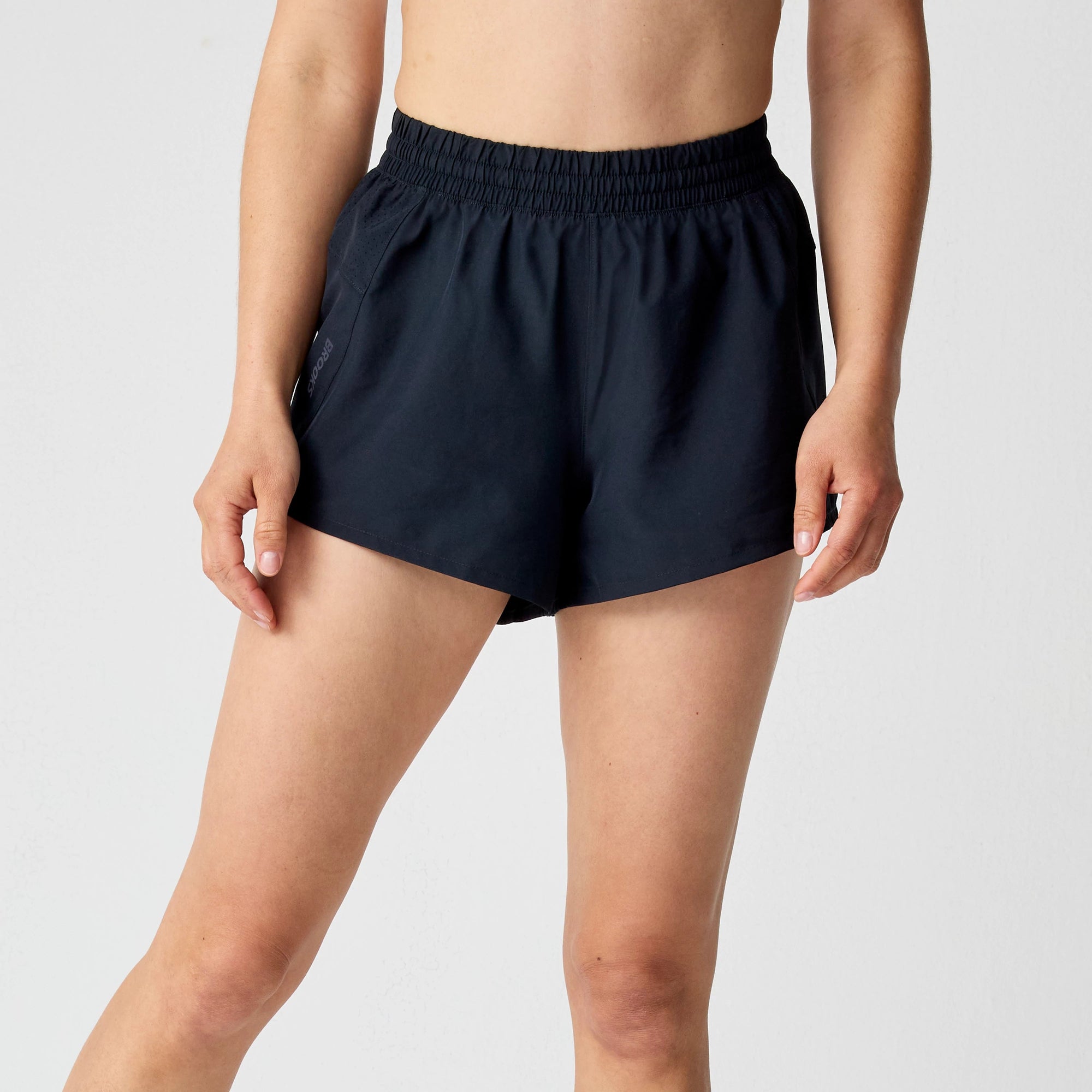 Women's athletic running shorts with elastic waistband and side pockets, front view