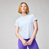 Light blue short sleeve athletic t-shirt with crew neck, front view on model