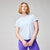 Light blue short sleeve athletic t-shirt with crew neck, front view on model