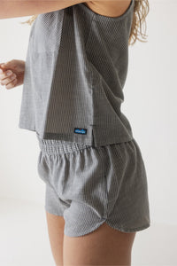 Gray pinstriped sleeveless top and matching shorts set worn by model