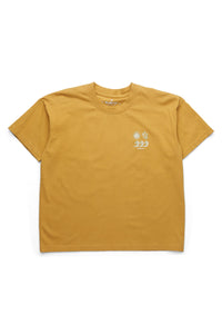 Mustard yellow short-sleeve t-shirt with small white graphic design on chest, front view