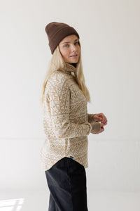 Women's turtleneck pullover sweater with geometric Fair Isle pattern, side view on model