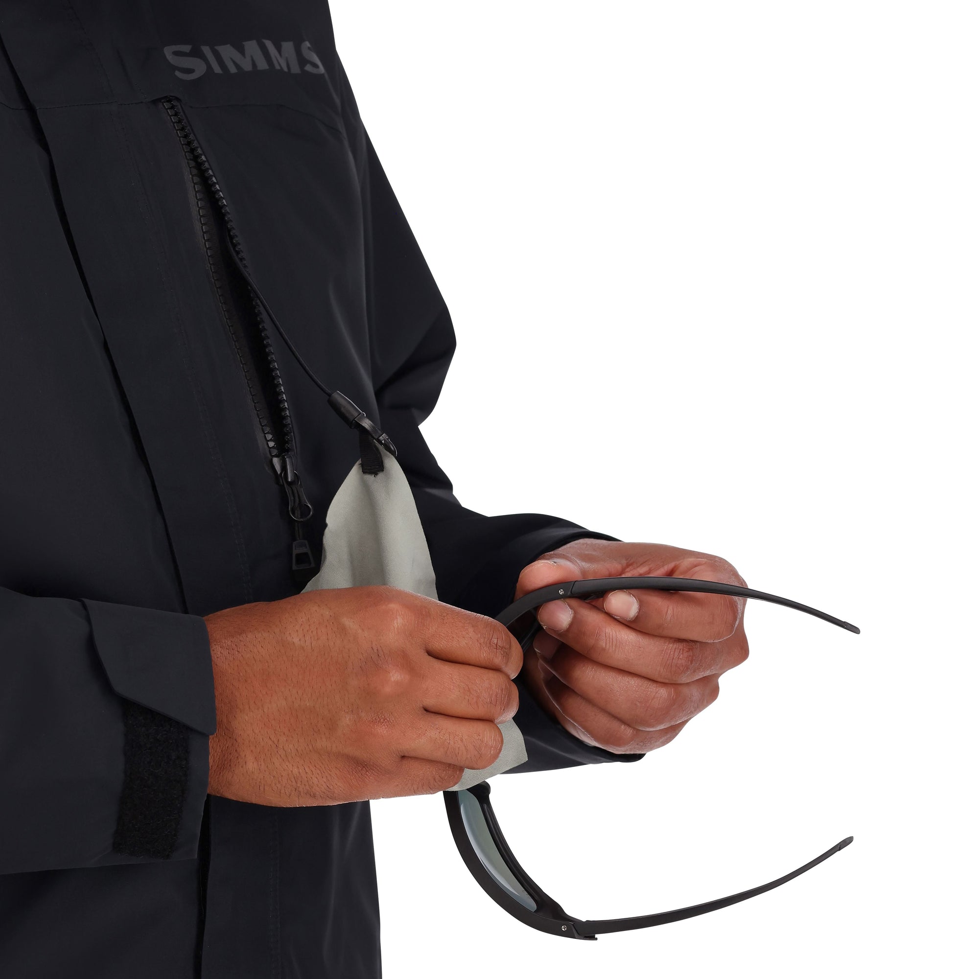 Black outdoor jacket with chest zip pocket and internal drawcord adjustment details