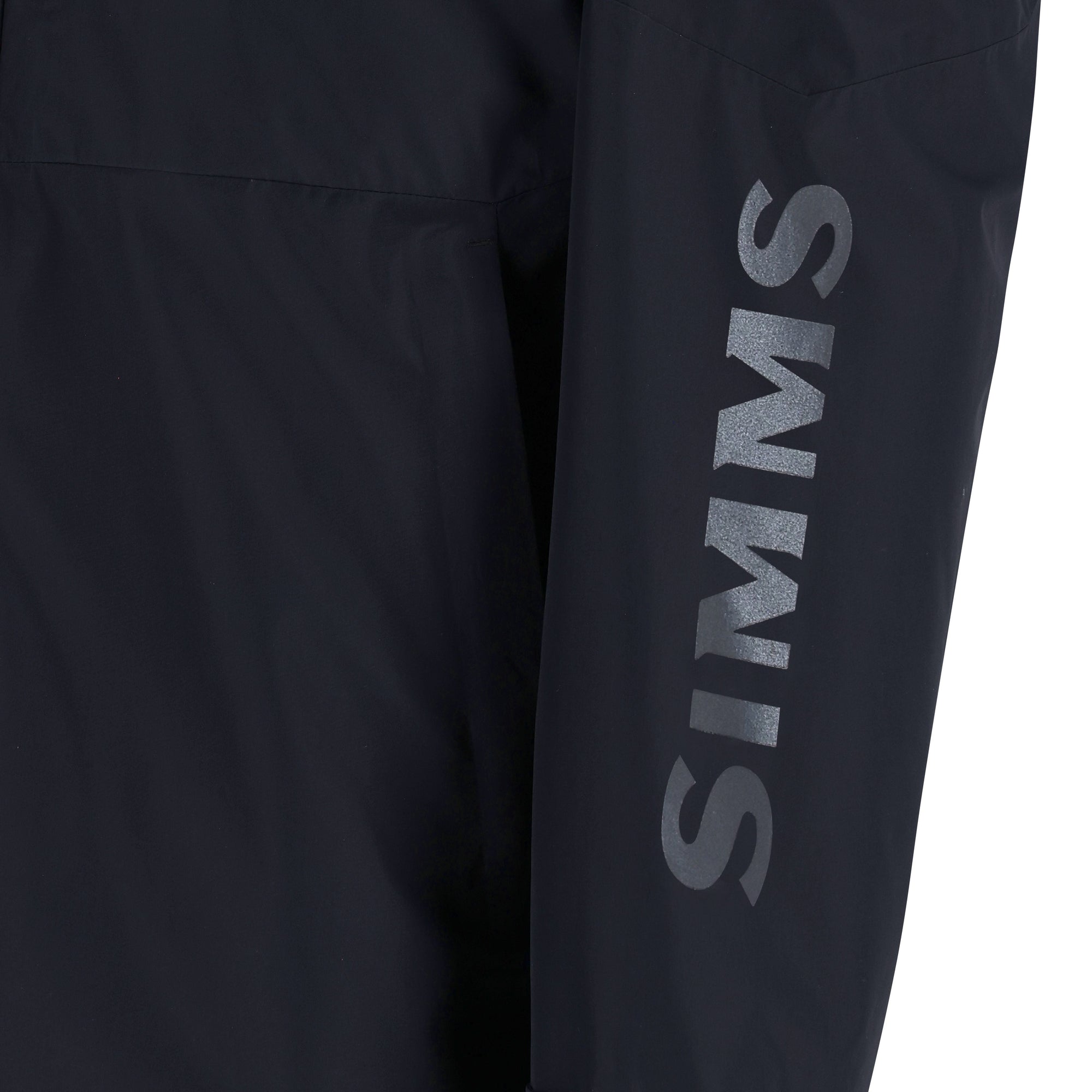 Dark outdoor jacket with chest pockets and brand logo on sleeve, close-up view
