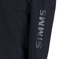 Dark outdoor jacket with chest pockets and brand logo on sleeve, close-up view