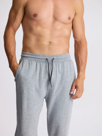 Men's grey jogger pants with elastic waistband, drawstring, and side pockets, front view