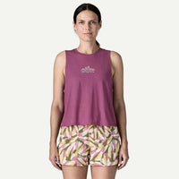 Purple sleeveless cropped tank top with mountain logo, front view on model