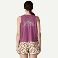 Purple sleeveless tank top with mountain graphic design, shown from back view on model