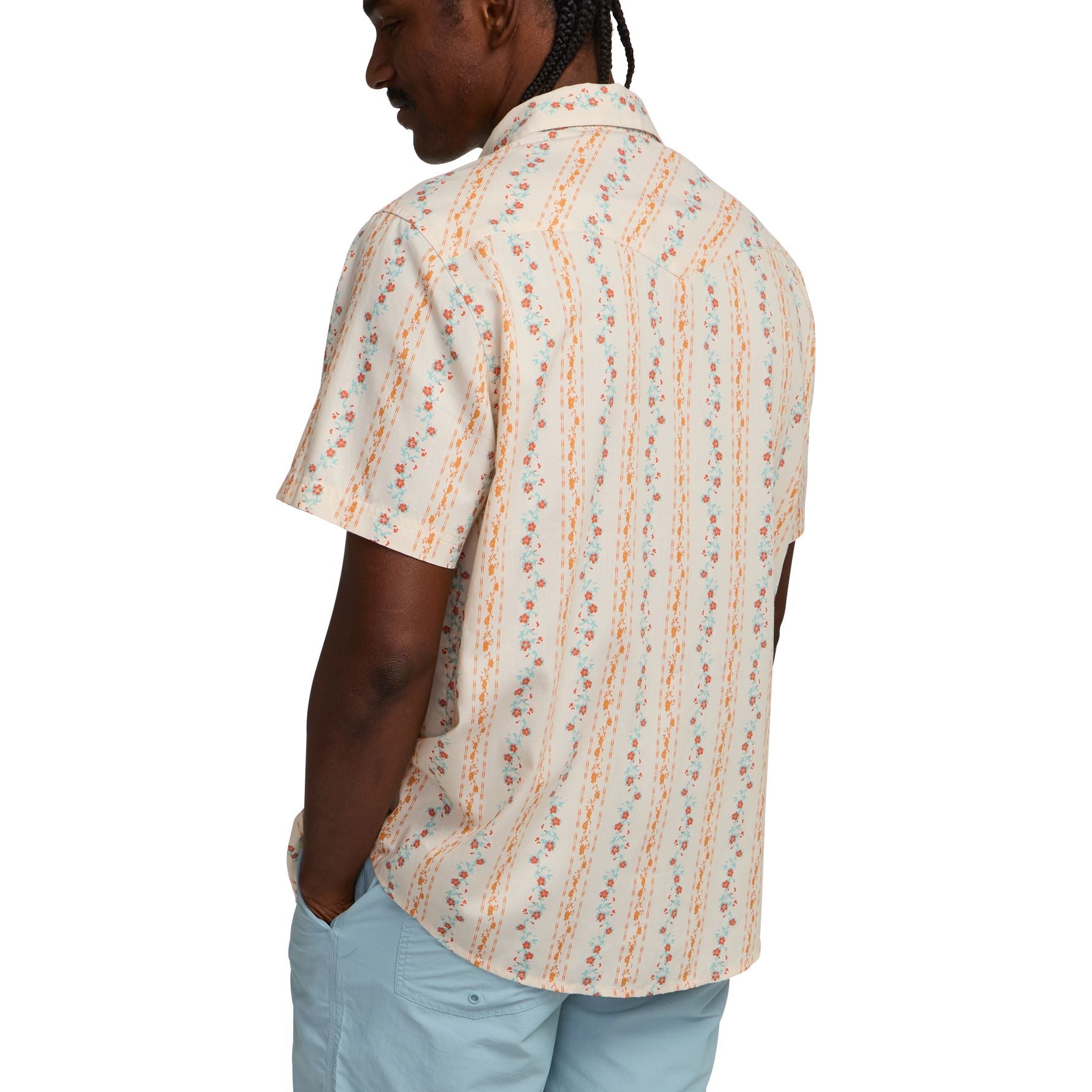 Men's short-sleeve floral striped button-up shirt, back view on model, with light blue pants