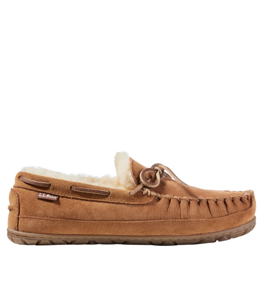 Brown suede moccasin slipper with sherpa lining, lace tie, and rubber sole, side view