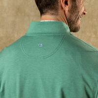 Back view of men's quarter-zip pullover in heather green showing collar detail and logo