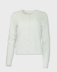 Light green crew neck cardigan with button closure, long sleeves, front view on white background
