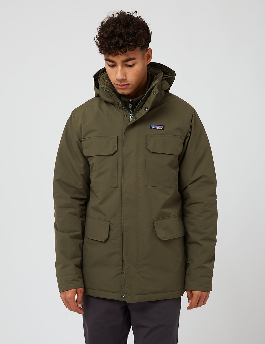 Men's hooded parka with four front pockets, full zip, on male model, front view