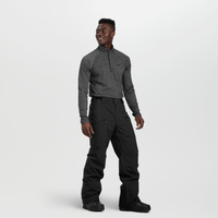 Men's black snow pants with cargo pockets, worn with gray quarter-zip base layer, front view