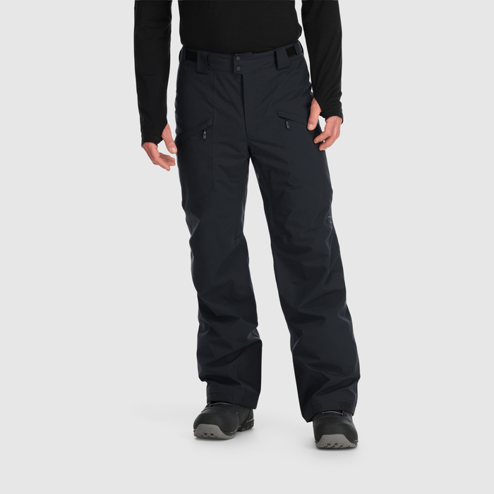 Men's black snow pants with cargo pockets, front view, worn with snowboard boots