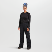 Women's black snow pants with multiple pockets, front view, paired with black base layer top
