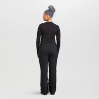 Women's black snow pants back view, relaxed fit with belt loops, worn with base layer top