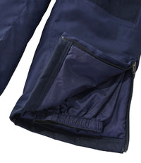 Close-up detail of navy bib pants hem showing zippered pocket, lining, and elastic cuff