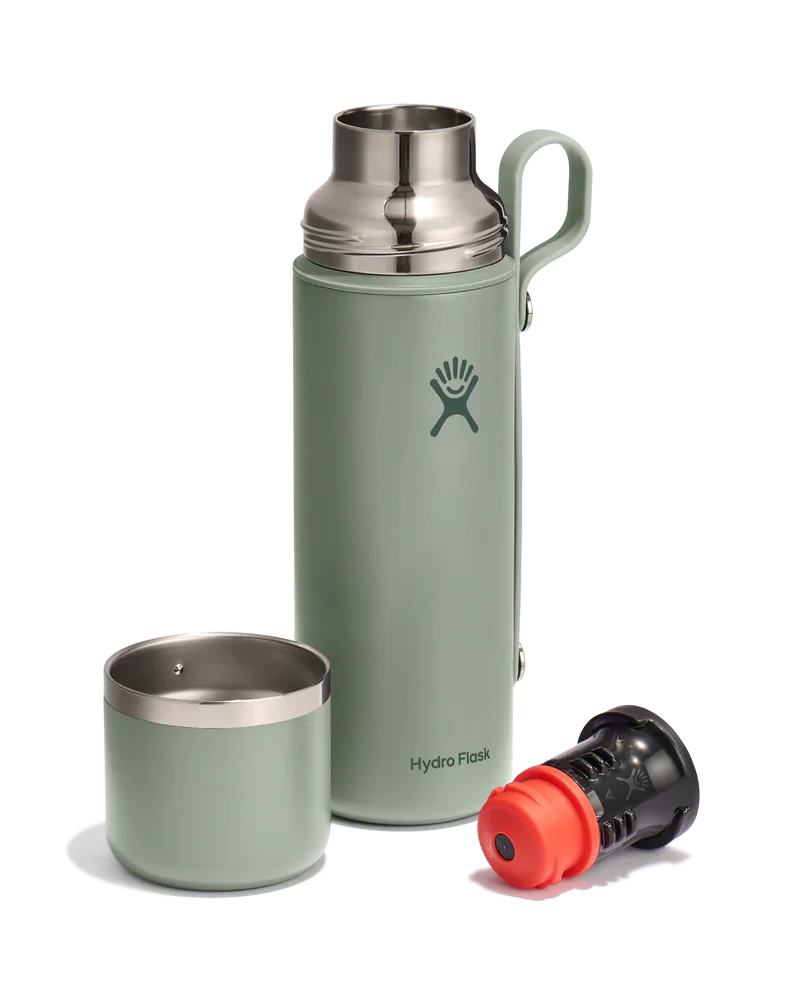 Insulated flask with matching cup and accessories displayed on white background
