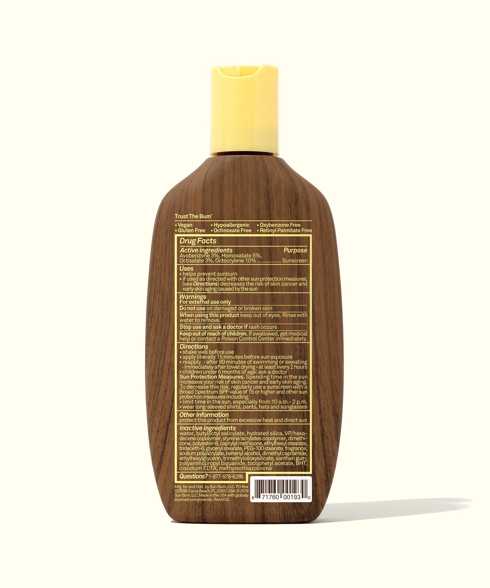 Brown sunscreen lotion bottle with yellow cap showing back label and product information