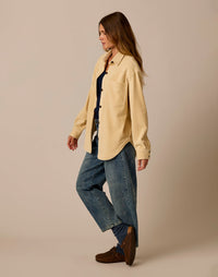 Women's oversized shacket in pale cream, side view, worn over navy top with jeans