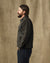 Men's short work jacket in dark charcoal, side profile view, with chest pockets and button closure