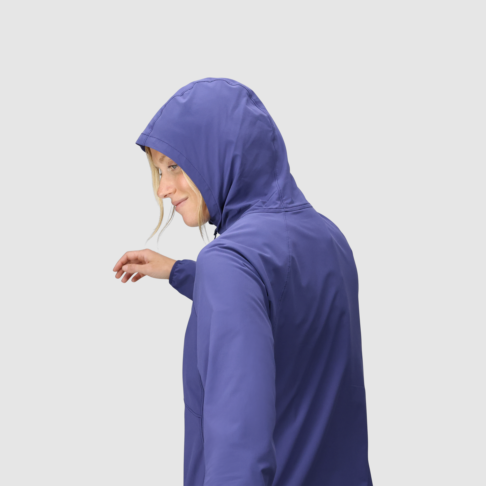 Women's hooded sun hoodie in slate blue, side view showing hood up and pocket detail