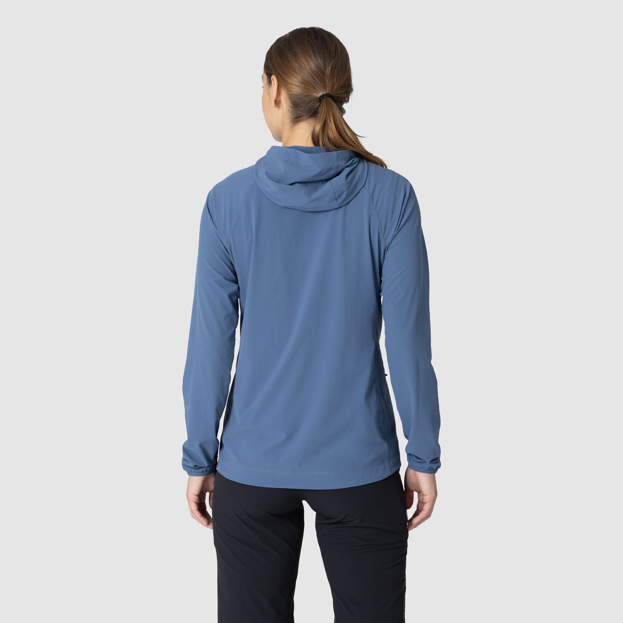 Women's long-sleeve hooded sun hoodie in slate blue, back view showing hood and slim fit