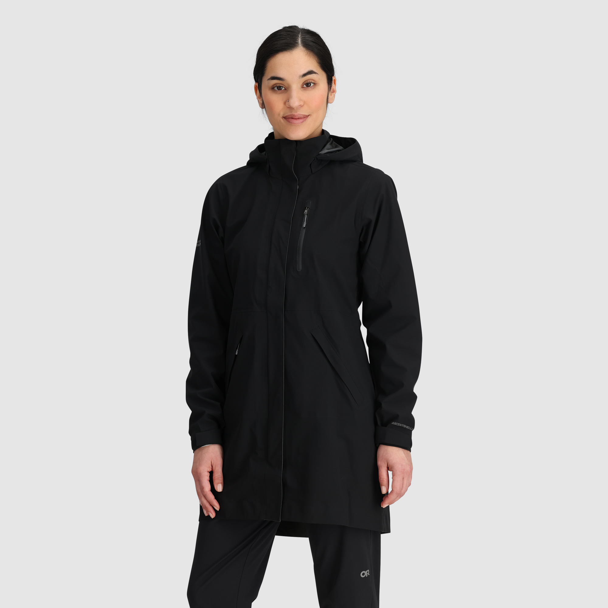 Women's long hooded rain trench coat in black with zippered chest pocket, front view