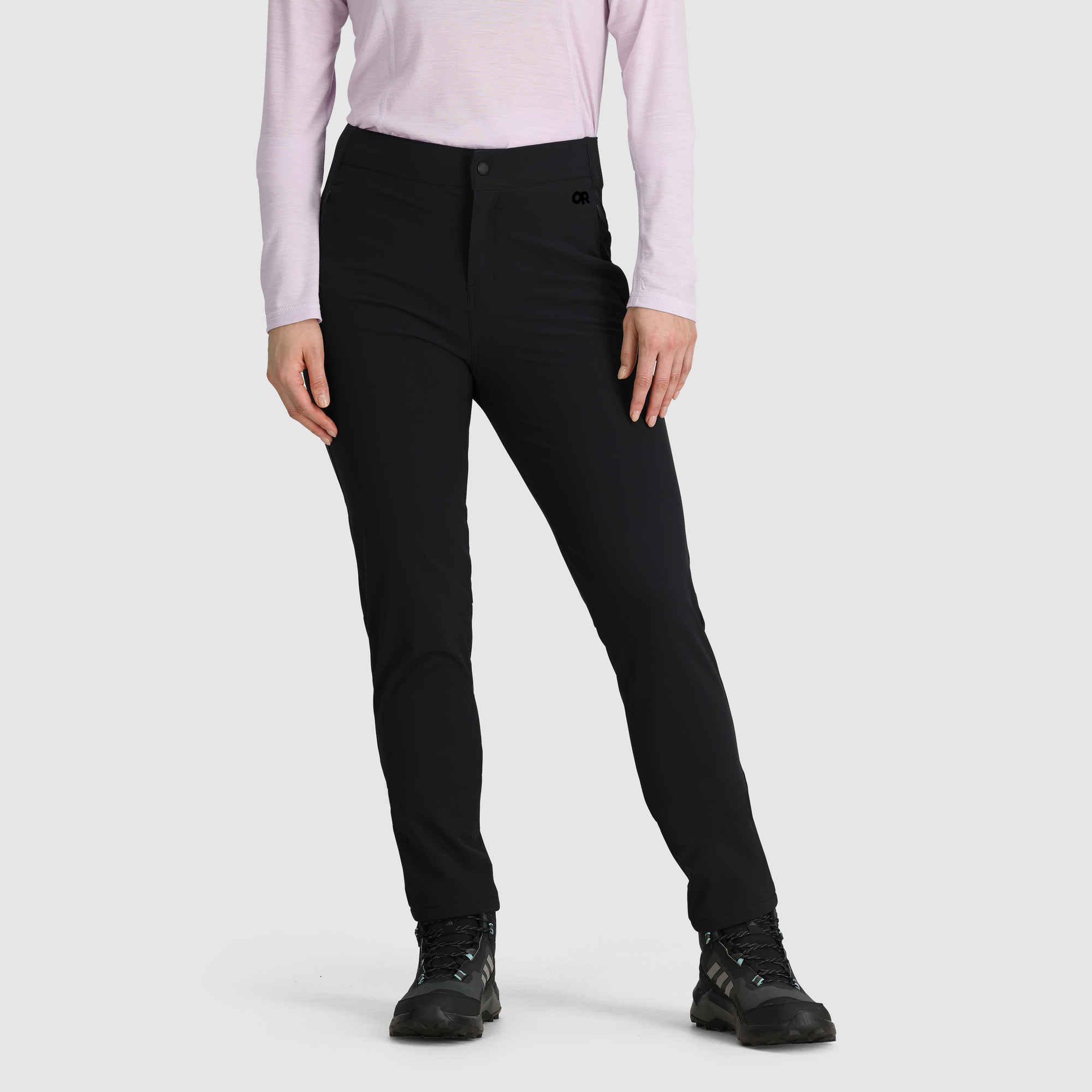 Women's black fleece-lined slim-fit pants, front view, worn with hiking shoes