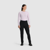 Women's black fleece-lined slim pants with button closure, shown front view with hiking boots