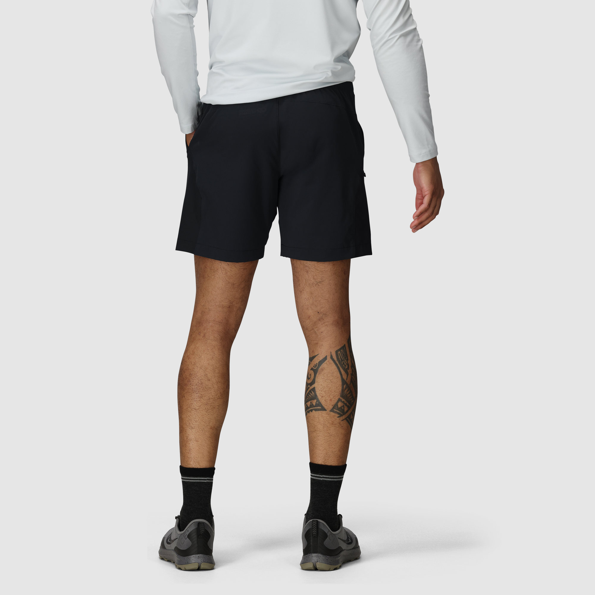 Black athletic shorts with 7-inch inseam shown from back view on model