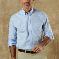 Light blue long sleeve button-down shirt with chest pocket worn with khaki pants