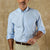Light blue long sleeve button-down shirt with chest pocket worn with khaki pants