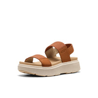 Brown leather platform sandals with adjustable straps and cream sole, side view