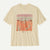 Cream colored oversized t-shirt with desert landscape graphic featuring mountains and desert plants