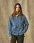 Women's long-sleeve denim shirt with dual chest pockets and snap buttons, front view