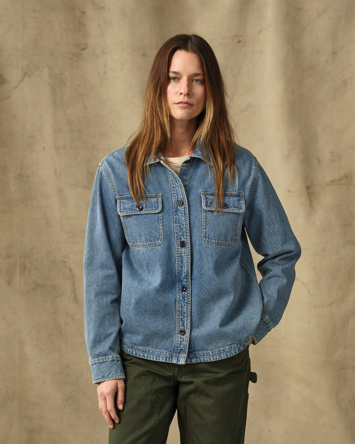 Women's long-sleeve denim shirt with dual chest pockets and snap buttons, front view