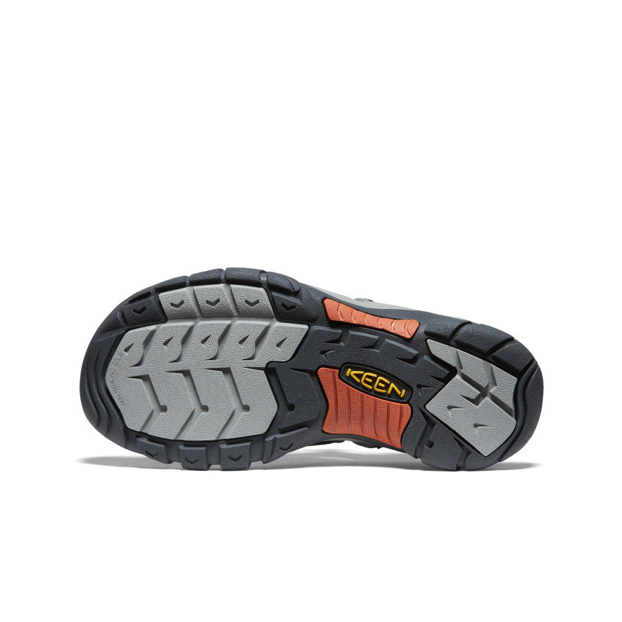 Bottom view of hiking sandal showing treaded outsole with gray and orange rubber sections