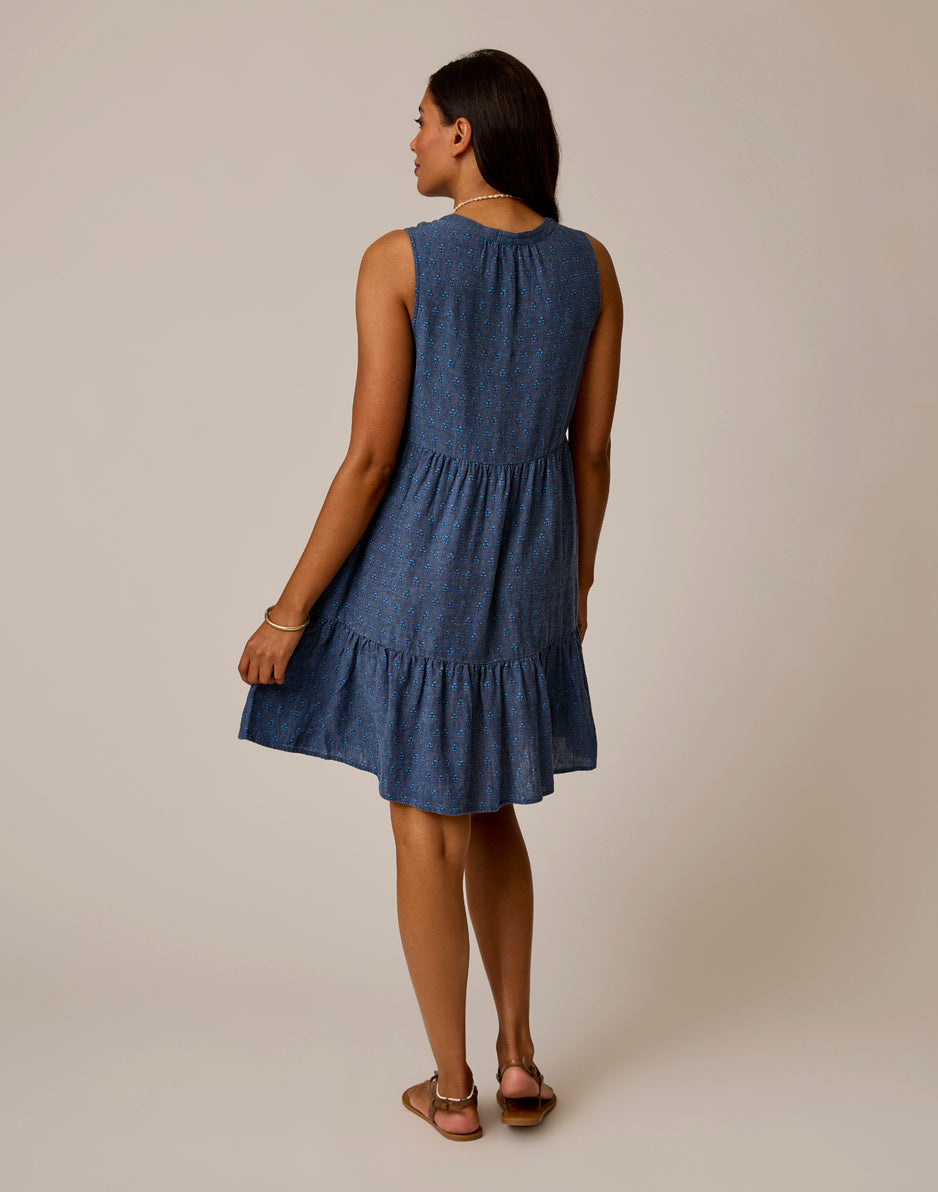 Sleeveless tiered dress with small print pattern, back view on model