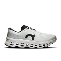 White running shoe with distinctive holed sole, side profile view showing mesh upper