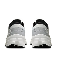 Running shoes rear view showing white and gray gradient design with chunky sole