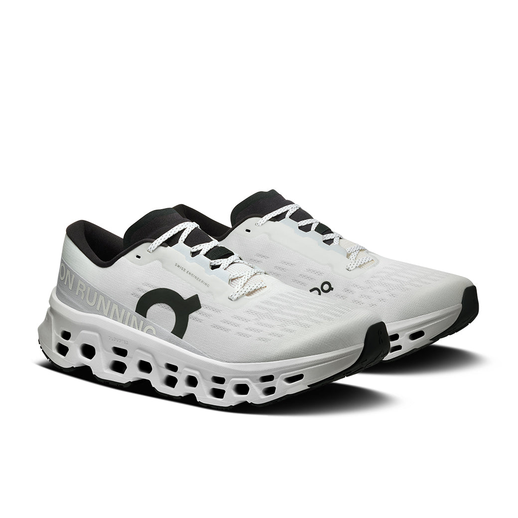 White running shoes with distinctive perforated sole and black collar details, angled side view