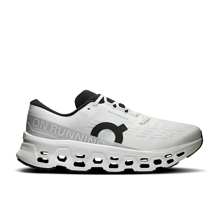 White running shoe with distinctive holed sole, side profile view showing mesh upper