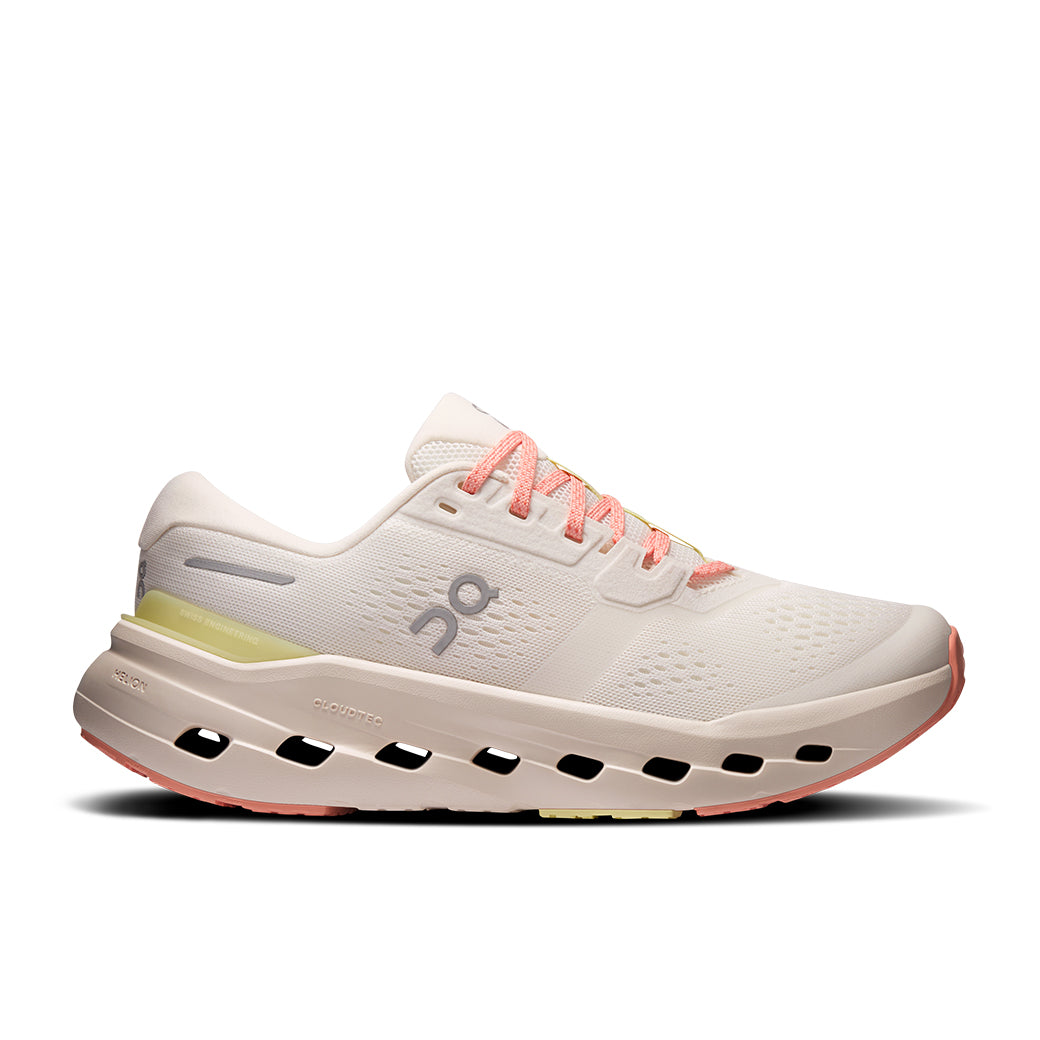 Light colored running shoe with distinctive cloud sole pods and coral pink laces, side view