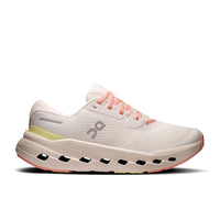 Light colored running shoe with distinctive cloud sole pods and coral pink laces, side view